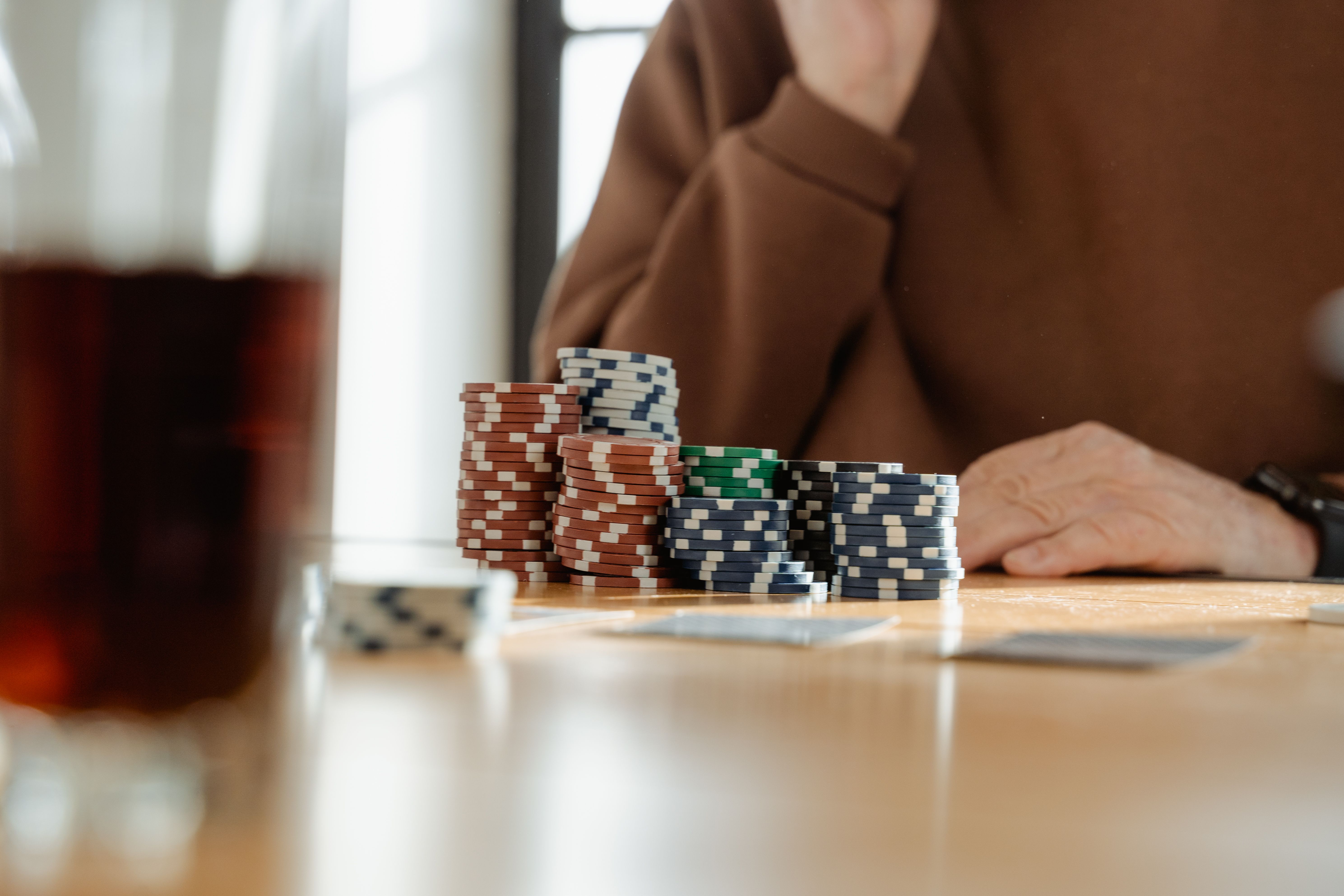 Casino chips stacked on a table during a card game